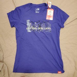 The North Face Graphic T-shirt. Purple with "Defend Our Land" Slogan